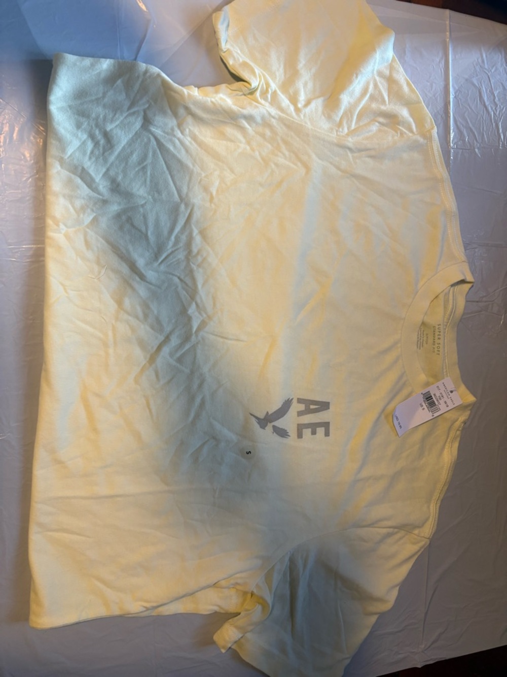 American Eagle Outfitters Men's Short-Sleeve Tee in Pale Yellow with AE Logo